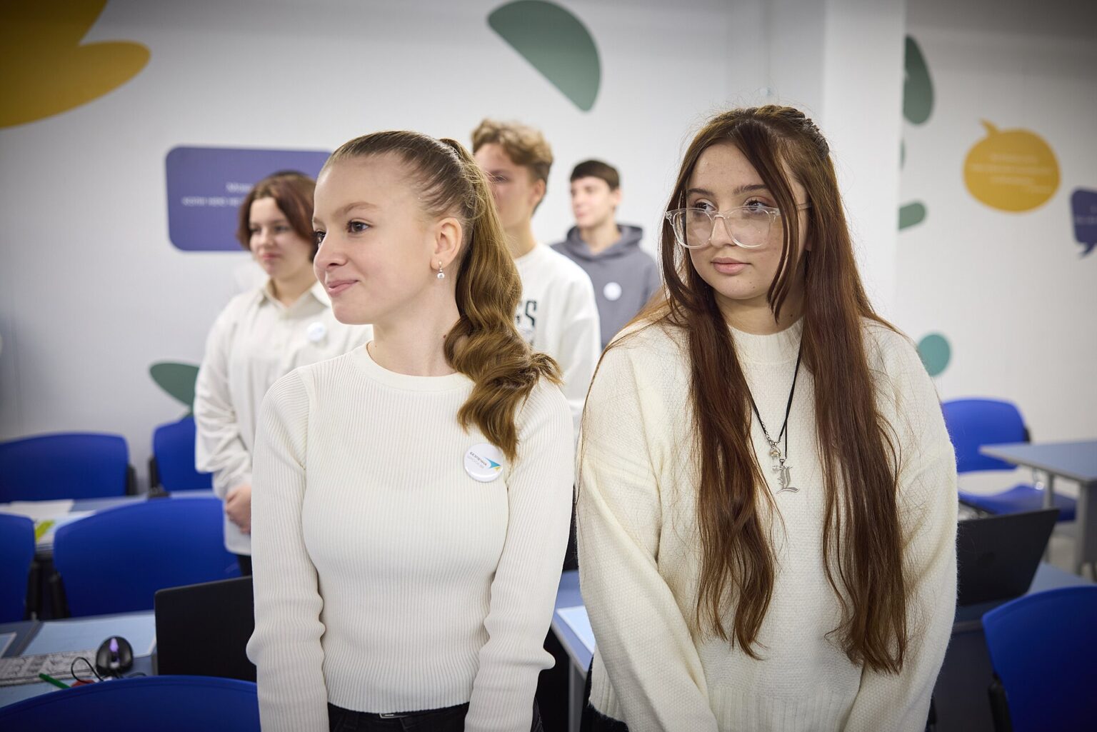 Students in a classroom with smartphones put away during a lesson